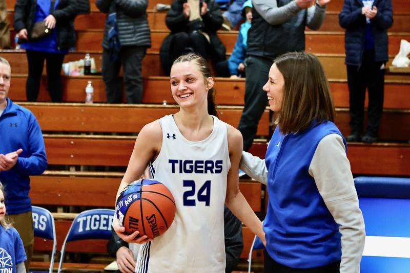 Princeton coach Tiffany Gonigam congratulates PHS senior Keighley Davis after she became Princeton's all-time leading scorer, boys or girls, Monday night at Prouty Gym.