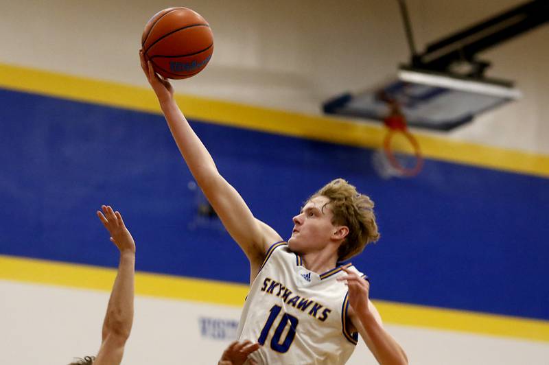 Johnsburg's Ben Person drives to the basket agains Woodstock North during a Kishwaukee River Conference boys basketball game Wednesday, Jan. 18, 2023, at Johnsburg High School.