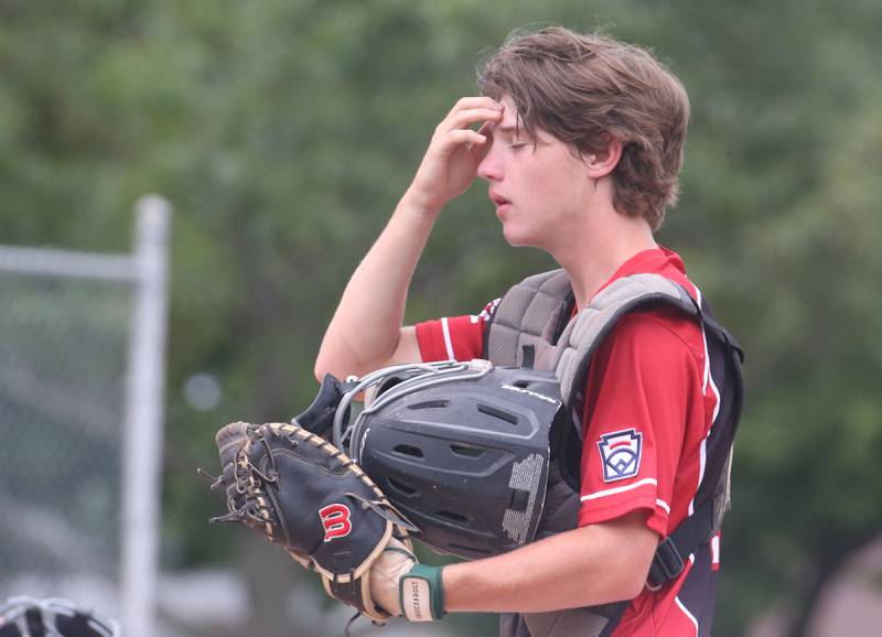 Spring Valley catcher Carson Riva reacts after a run scores while playing Burbank in the Central Regional Senior Baseball Regional tournament at J.A. Happ Field in Washington Park in Peru.