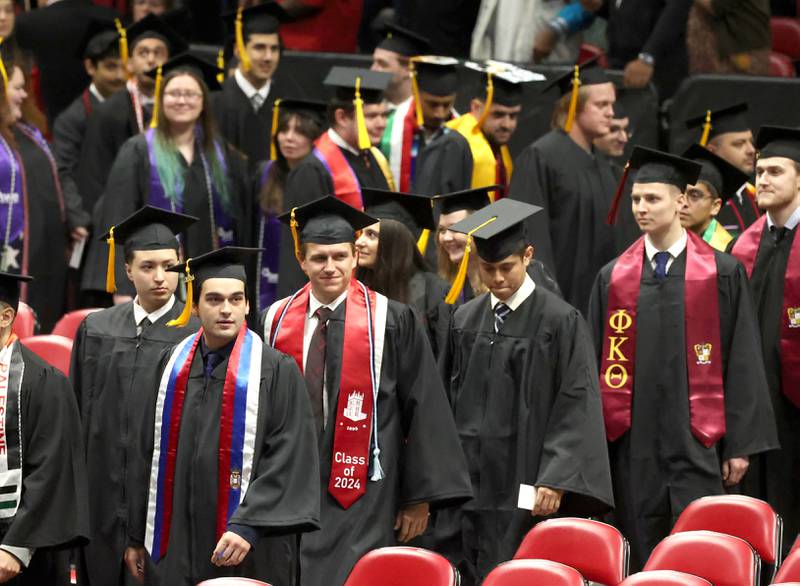Northern Illinois University candidates for graduation are seated at the beginning of the first of two undergraduate commencement ceremonies Saturday, May 11, 2024, in the Convocation Center at NIU in DeKalb.