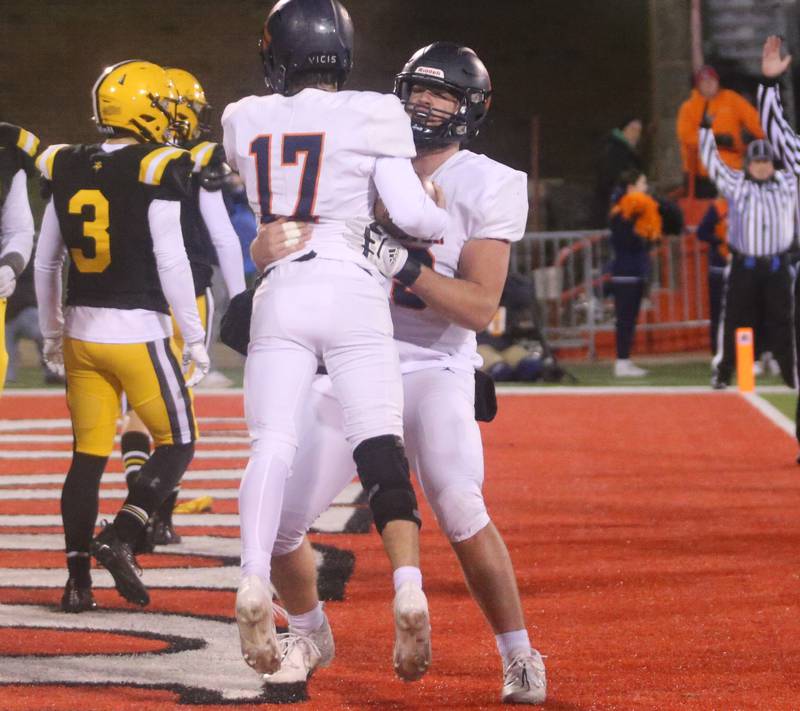 Rochester's Parker Gillespie hugs teammate Jake Milliron during the Class 4A State football championship on Friday, Nov, 24, 2023 at Hancock Stadium in Normal.