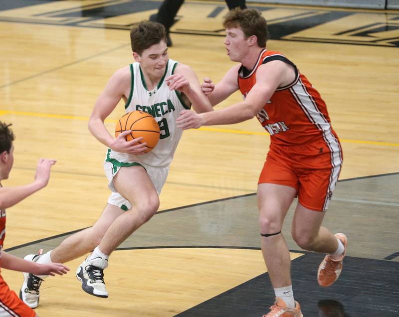 Seneca's Brady Sheedy drives to the hoop as Roanoke-Benson's Henry Kneep defends during the Tri-County Conference Tournament on Tuesday, Jan. 27, 2026 at Putnam County High Schooo.