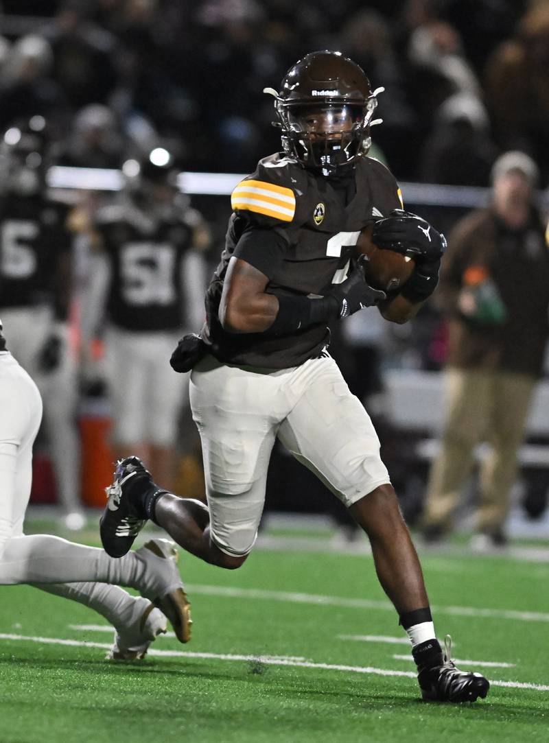 Joliet Catholic's Jayden Armstrong (3) rushes the ball during the conference game against Providence Catholic on Friday, OCT. 24, 2025, at Joliet.
