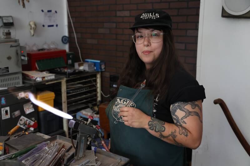 Angelica Cristal poses inside her shop. Angelica is opening her own glass art business in the former Regis Glass Art Space in Downtown Joliet.