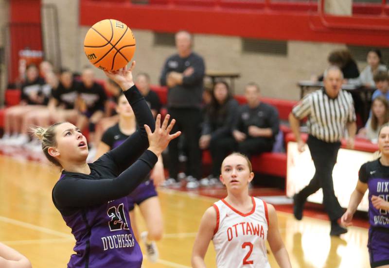 Dixon's Reese Dambman eyes the hoop as Ottawa's Ashlynn Ganiere watches on Wednesday, Dec. 3, 2025 in Kingman Gymnasium at Ottawa High School.