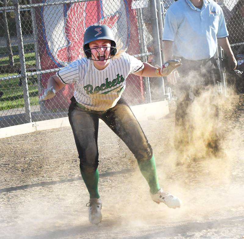Rock Falls' Zoey Silva celebrates after crossing home plate to give the Rockets their first run against Winnebago during their 2A Oregon Regional semifinal game on Wednesday, May 20, 2026 at Oregon Park West. The Rockets went on to win the game 7-2 and will play Oregon for the regional championship on Saturday.