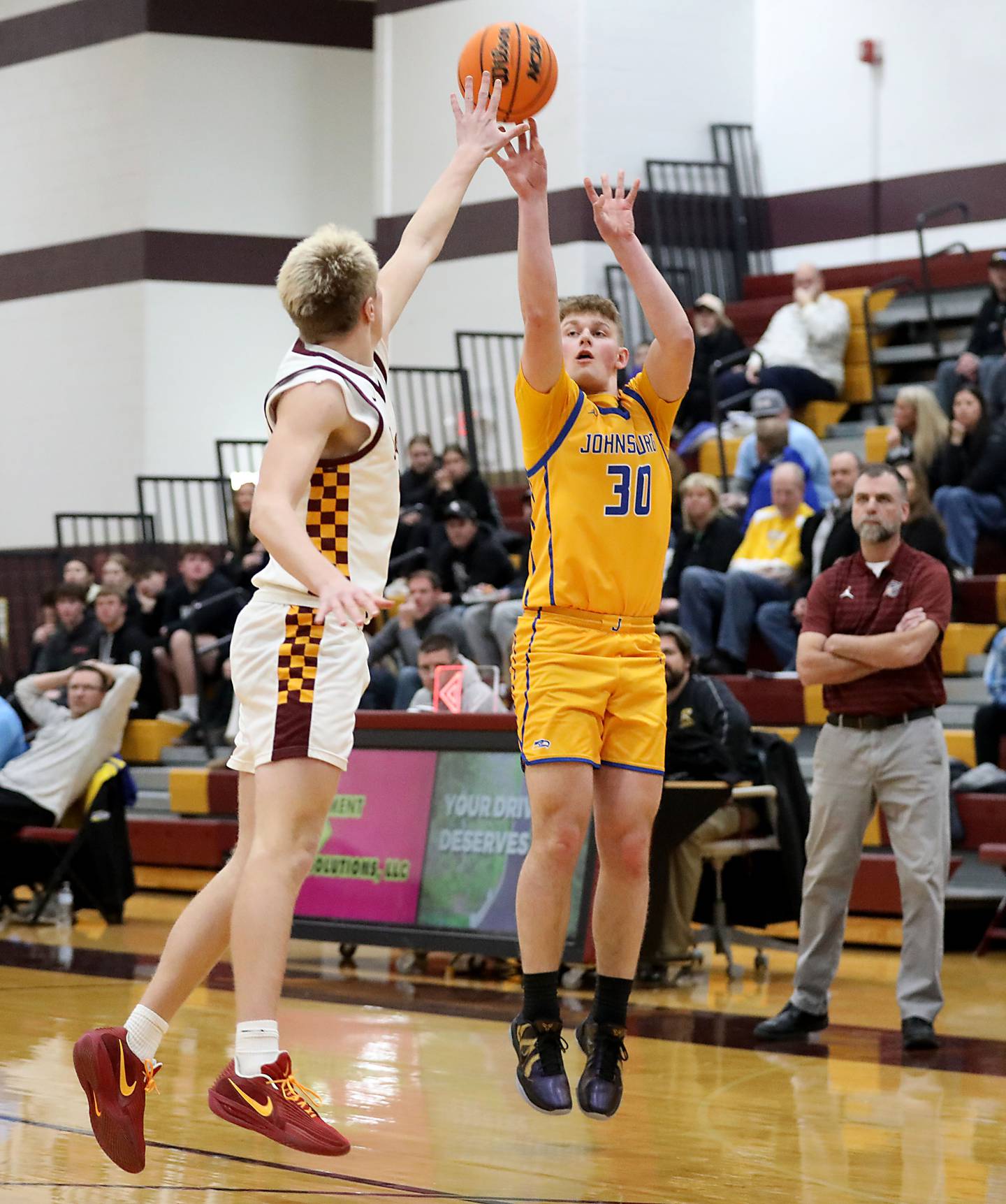 Johnsburg's Jayce Schmitt shoots the ball over Richmond-Burton's Luke Robinson during a Kishwaukee River Conference boys basketball game on Tuesday, Jan. 27, 2026, at Richmond-Burton High School.