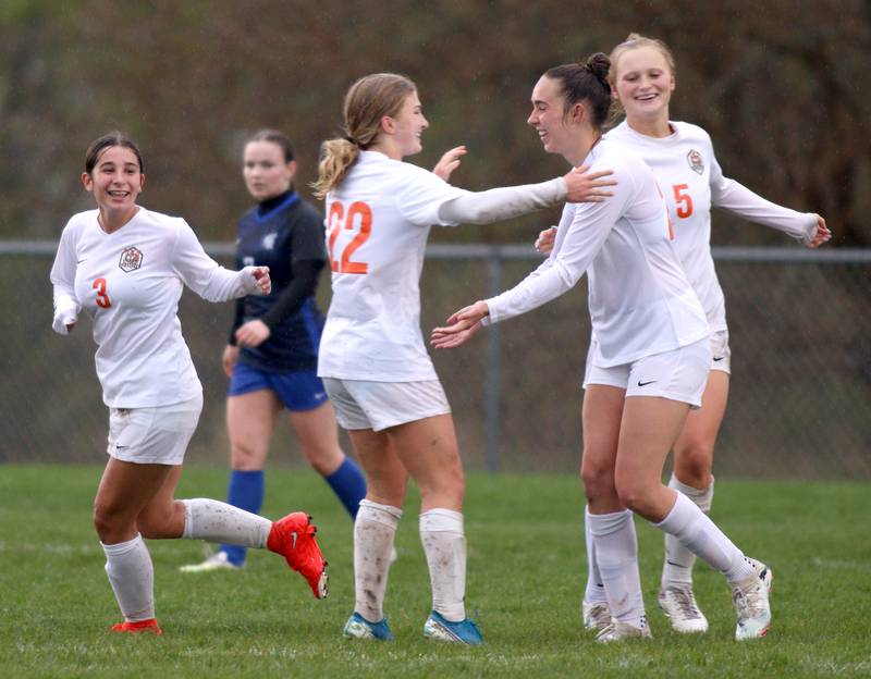 Crystal Lake Central’s Tigers celebrate a Jillian Mueller goal in varsity soccer at Burlington Thursday night. Mueller is second from right.