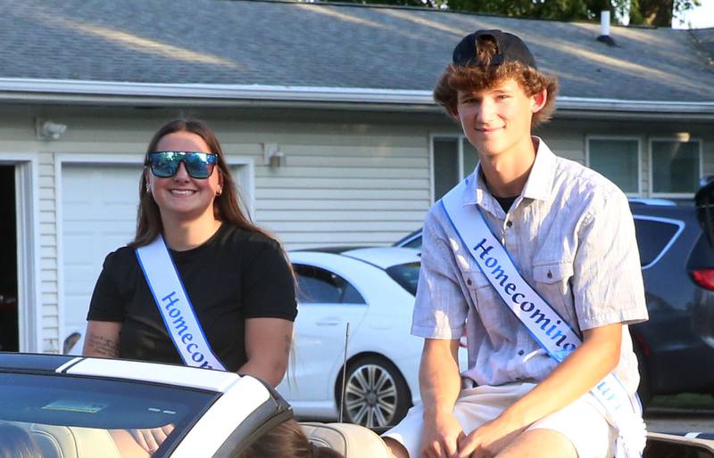 Putnam County High School senior court students Sydney Samek and Brayden Zuniga ride during the inaugural Homecoming parade on Wednesday, Sept. 17, 2025 down Elm Street in Granville.