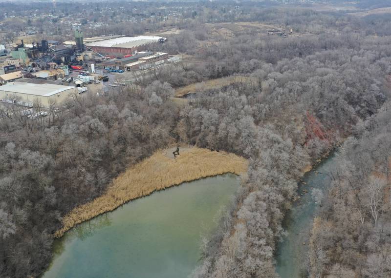 The Little Vermilion River (bottom left) flows nearby to the Carus Chemical plant (top left) as crews extinguish a massive fire on Wednesday, Jan. 11, 2023 in La Salle.