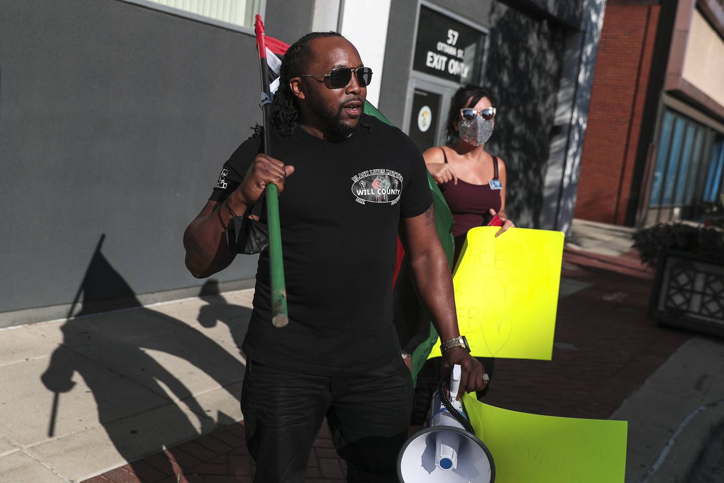 Joliet Black Lives Matter activist Karl Ferrell marches to call for further investigation into the death of Eric Lurry, a Joliet resident who died while in police custody, on Friday, Sept. 17, 2021, outside of the District AttorneyÕs Office in Joliet, Ill.