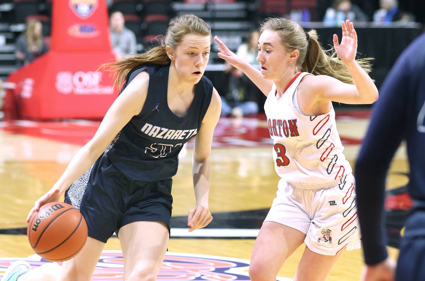 Nazareth's Caroline Workman drives against Morton's Paige Griffin during their Class 3A state semifinal game Friday, March 4, 2022, in Redbird Arena at Illinois State University in Normal.