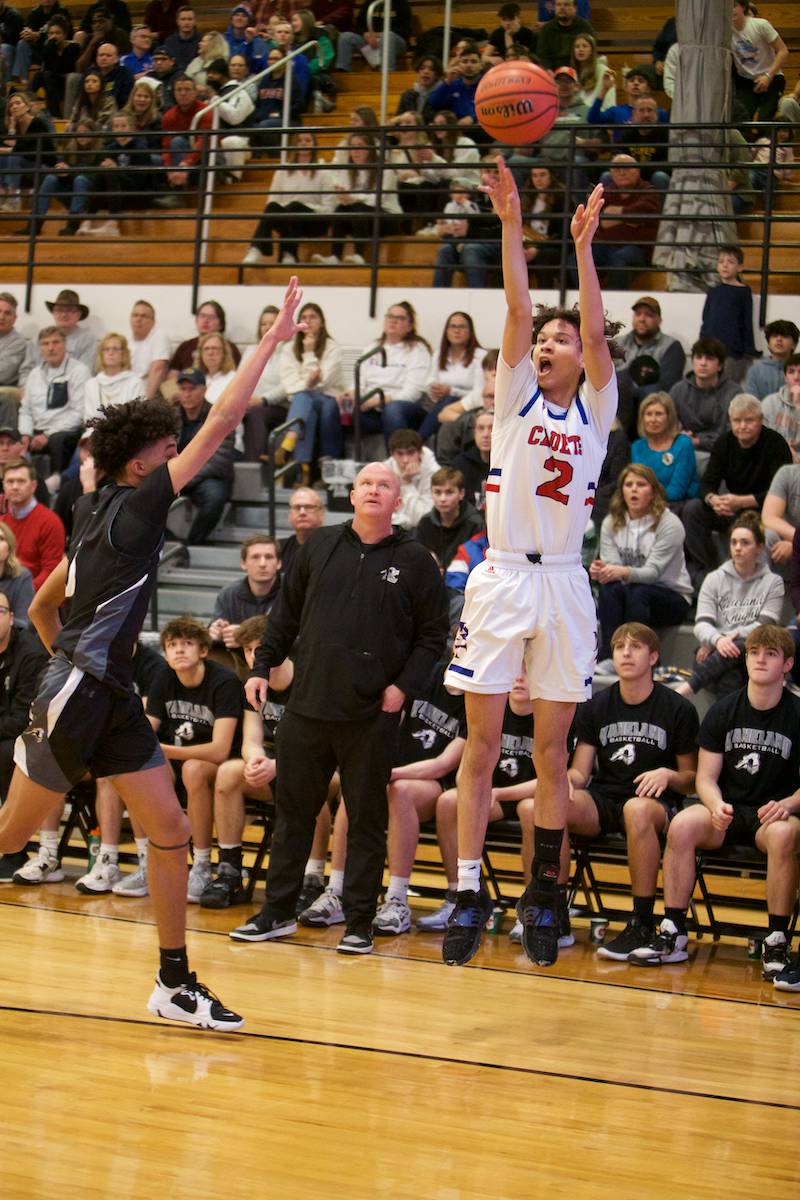 Marmion Academy's Jabe Haith shoots a three pointer against Kaneland at the Class 3A Regional Final at Kaneland on Saturday, Feb.25, 2023.