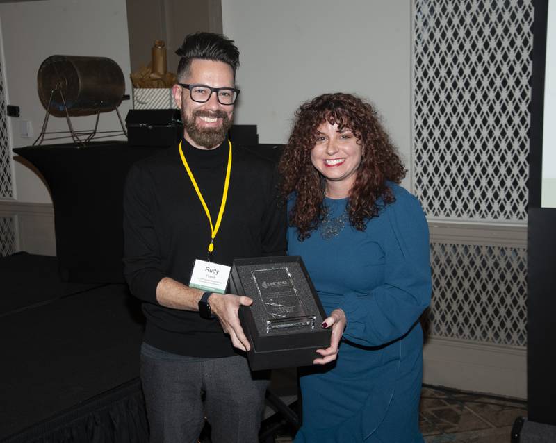 Grundy Chamber President & CEO Christina Van Yperen accepts the Outstanding Chamber of the Year Award from Illinois Association of Chamber of Commerce Executives Board Chair Rudy Flores who also is the President of the Lincoln Square/Ravenswood Chamber of Commerce (Chicago).