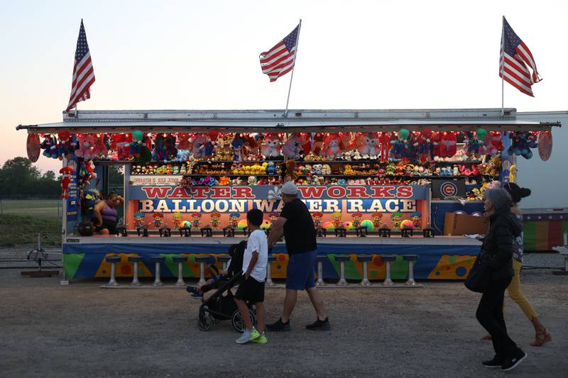 People check out one of the carnival games at Lockport’s Canal Days on Friday, June 9, 2023.