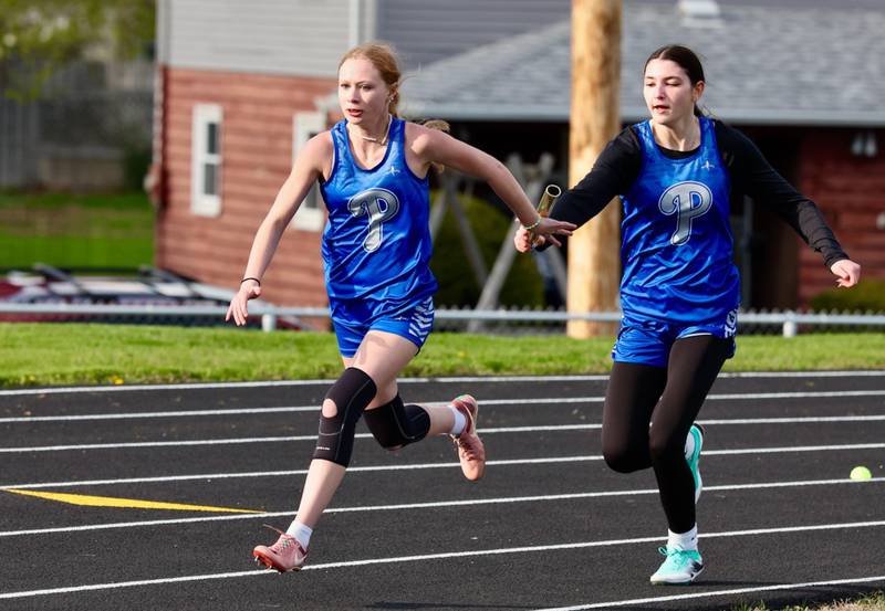 Princeton's Kinley Fogarty hands off to Journey Short in the  4x100 relay in Monday's Ferris Invite at Princeton.