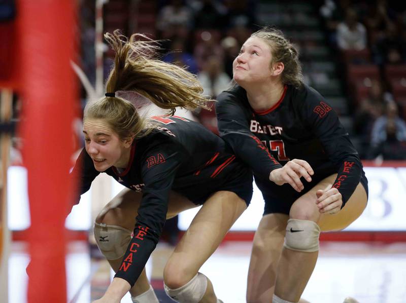 Benet's Audrey Asleson (7) and Annie Eschenbach (17) collide after diving for the last point during the IHSA Class 4A girls volleyball state title game between Benet Academy and Mother McAuley Saturday November 12, 2022 at Redbird Arena in Normal.