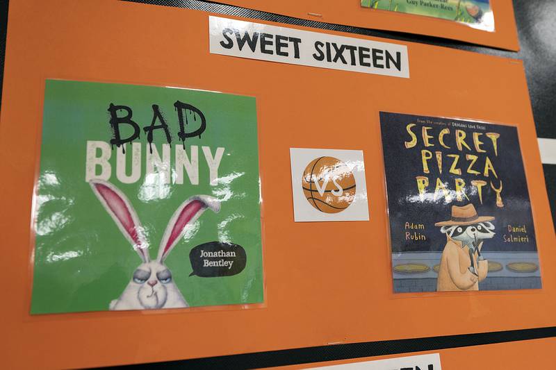 Pitzer chooses sixteen books, reads two of them at a time and lets the kids choose which one advances.