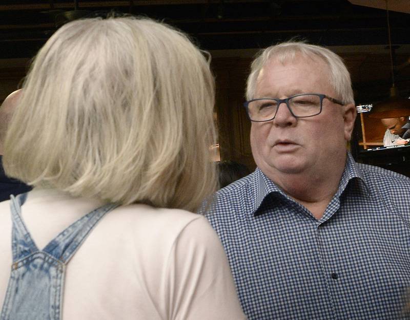 Ottawa Mayor Dan Aussem talks with a supporter on Tuesday April 4, 2023 at J.J.’s Pub in Ottawa.