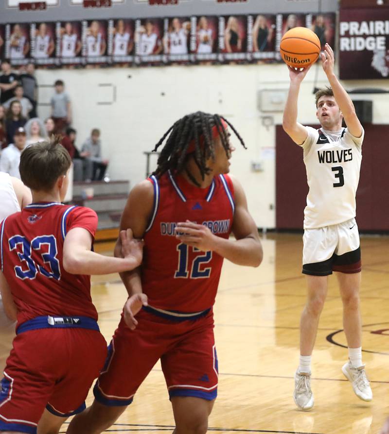 Prairie Ridge's Rory Rezendes shoot a three-pointer against Dundee-Crown during a Fox Valley Conference boys basketball game on Friday, Jan. 16, 2026, at Prairie Ridge High School in Crystal Lake.