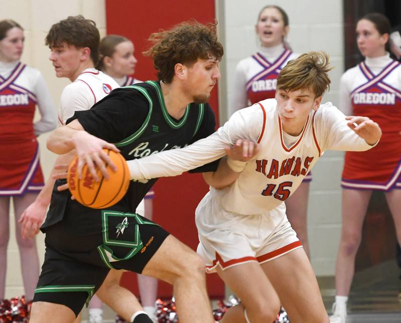 Oregon's Brian Wallace (15) knocks the ball away from Rock Falls' Cole Munix (12) during action on Friday, Jan. 9, 2026 at the Blackhawk Center in Oregon.