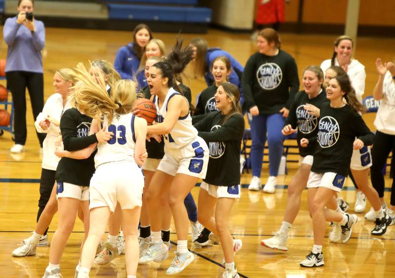 Geneva players celebrate their overtime win over Naperville North on Tuesday, Nov. 29, 2022.