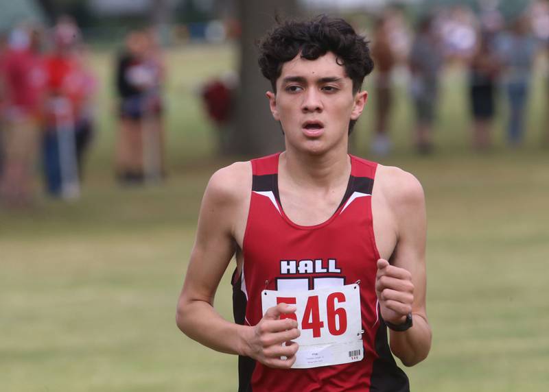 Dixon's Jense Atkinson and Daniel Ramirez compete during the Gary Coates Invitational cross country meet on Saturday, Sept. 13, 2025 at Zearing Park in Princeton .