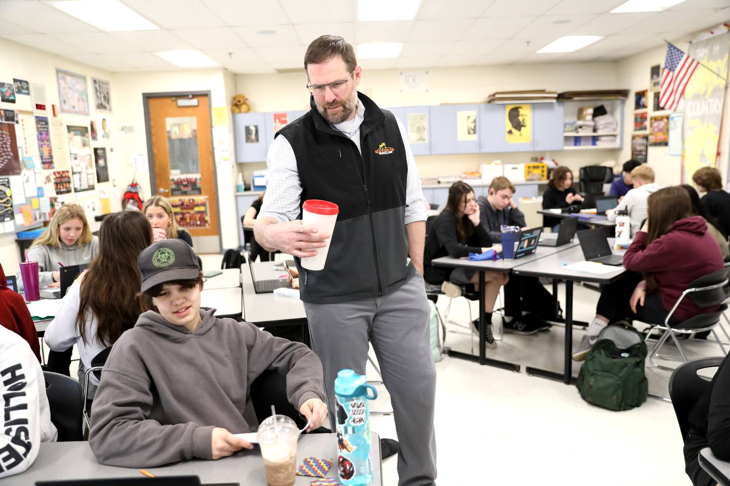 Batavia High School social studies teacher Scott Bayer during a recent class. Bayer is also the head coach of the school’s girls wrestling team.