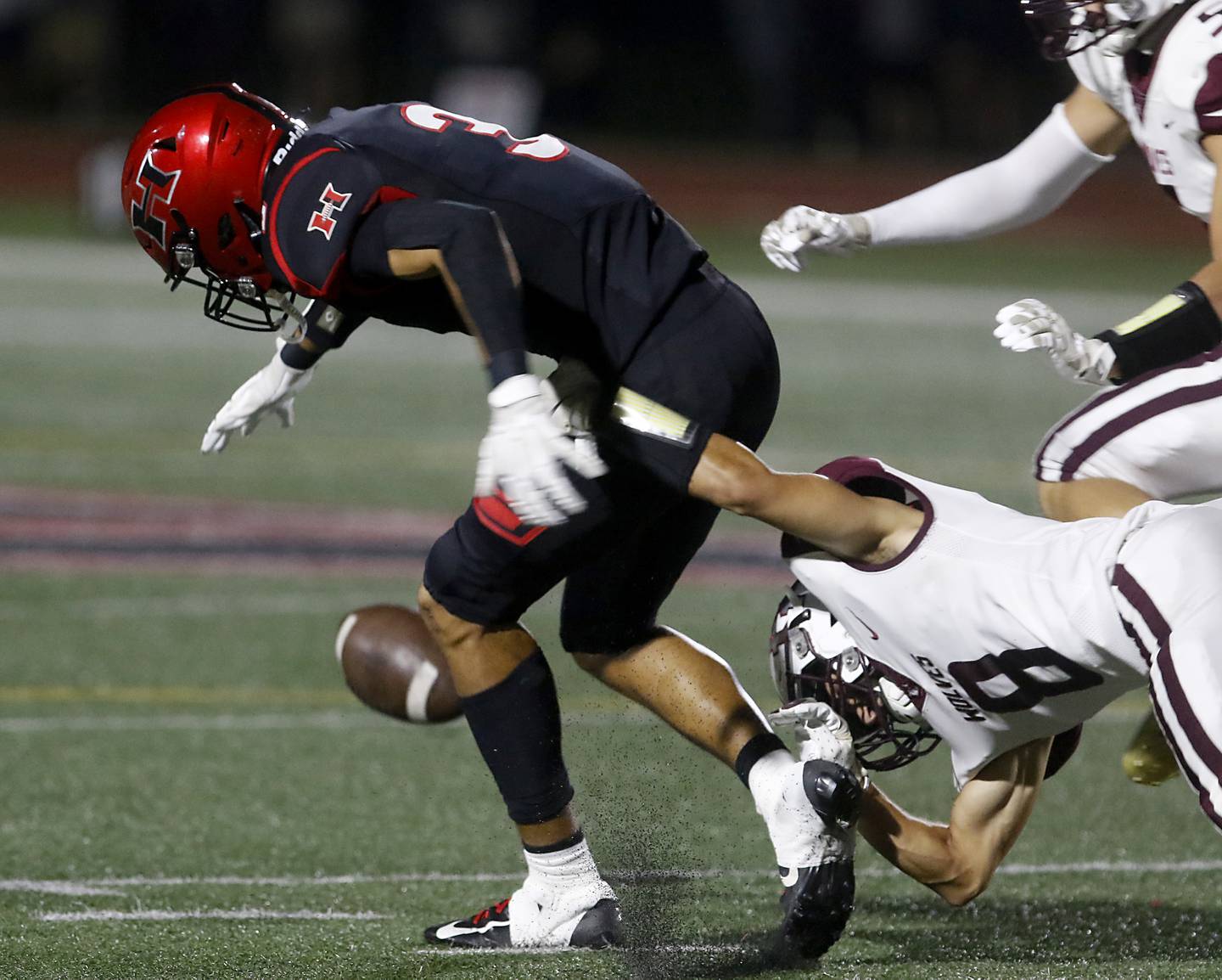 Prairie Ridge's Nicholas Schons (right) breaks up a pass intended for Huntley's Jordan Oruche during a Fox Valley Conference football game on Friday, Sept. 20, 2024, at Huntley High School.