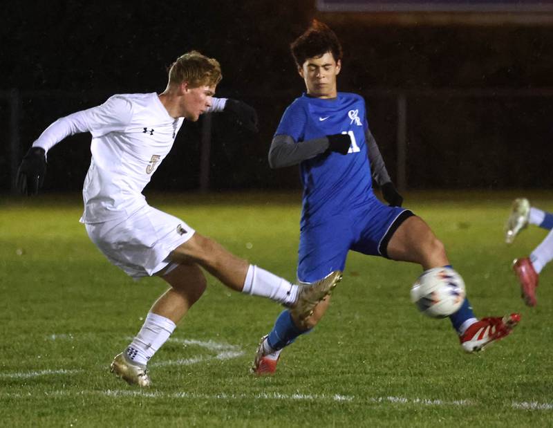 Sycamore's Aiden Sears kicks the ball by Burlington Central’s Niko Guzman Tuesday, Oct. 21, 2025, during their IHSA Class 2A regional semifinal match at Burlington Central High School.