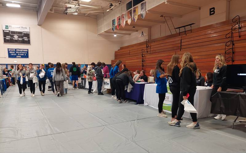 Students make their way to different tables of businesses and non-profit organizations Friday, April 19, 2024, at the Career, Job and Volunteer Fair at Princeton High School to explore career and volunteer opportunities.