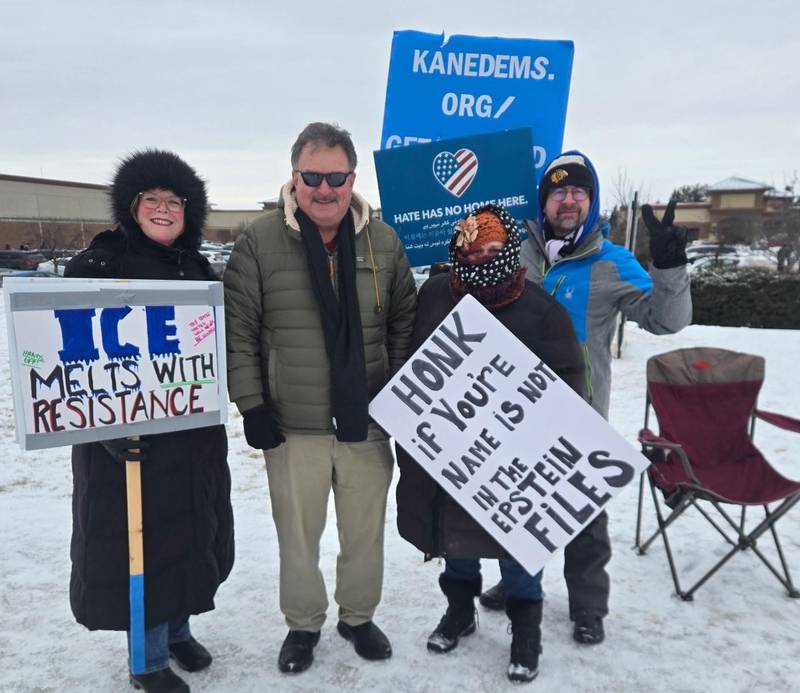 Some 200 protestors gathered on Randall Road in South Elgin Sunday, Jan. 25, 2026 in opposition to the ICE killing of Alex Pretti in Minnesota. Holding the 'ICE melts with resistance' sign is Kim Tarver, left, Kane County Democrats Chairman Mark Guethle, center, Jody Kanakula of Batavia and Geneva 1st Ward Alderperson William Malecki, far right.