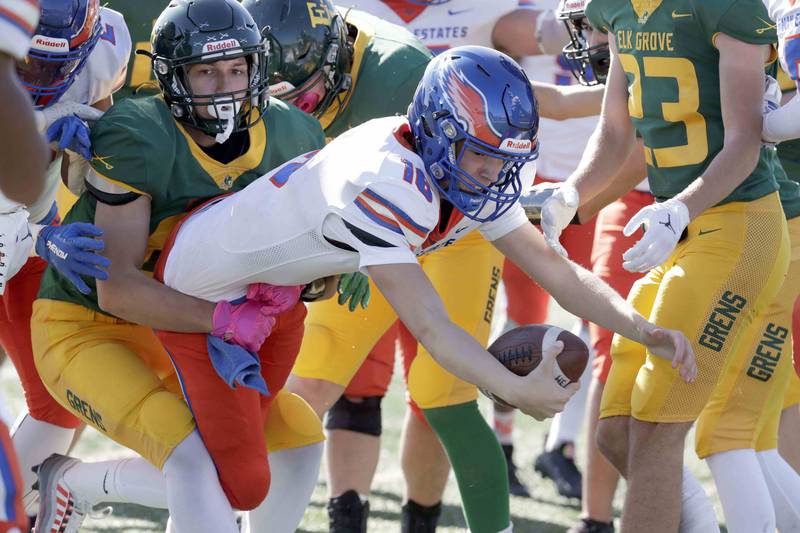 Hoffman Estates’ Aiden Cyr, 16, leaps in for a touchdown against Elk Grove Saturday October 29, 2022 in Elk Grove Village.