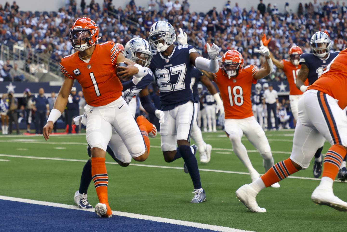 Chicago Bears' Justin Fields runs for a touchdown during the first half against the Dallas Cowboys Sunday, Oct. 30, 2022, in Arlington, Texas.