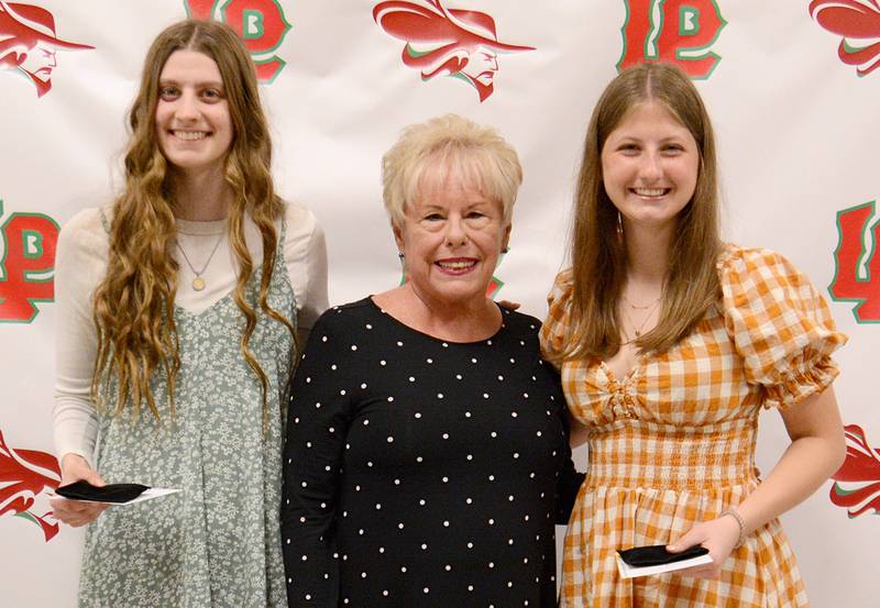 La Salle-Peru seniors Peyton Heagy (left) and Isabella Lambert (right) shared the George Preston Blow Medal/John and Lucy Pomatto Scholarship, presented by Jane Riva. The $1,500 scholarship is considered the highest award the L-P athletics department bestows. A recipient must have a GPA of at least 2.75 and have been outstanding in general athletics. Candidates are nominated by varsity head coaches and voted on by L-P administrators. Heagy was a three-time state qualifier in swimming and also participated in track and field. Lambert was all-area and captain of the soccer team while earning academic all-conference in soccer and volleyball.
