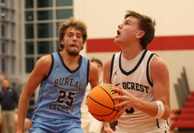 Fieldcrest's Eddie Lorton eyes the hoop after getting in the lane past Bureau Valley's Landon Hulsing during the 50th annual Colmone Classic on Monday, Dec. 9, 2024 at Hall High School.