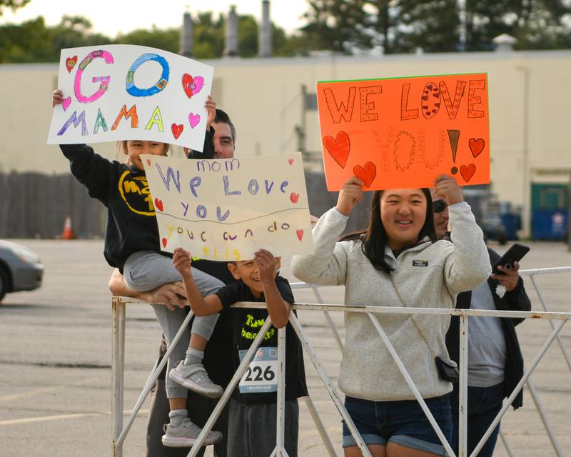 Makenna Whelan,5, Nick Whelan, Connor Whelan, 7, Ryann Cha 17, of Carol Stream cheer on their mom and wife during the Zoo Run 5K on Sunday Sept. 8, 2024, held at Brookfield Zoo in Brookfield.