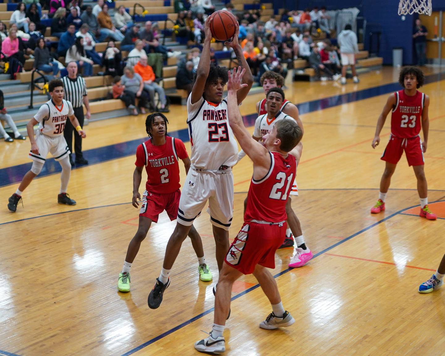 Oswego’s Dasean Patton (23) shoots the ball against Yorkville's Taelor Clements (21) during a basketball game at Oswego High School on Saturday, Jan 27, 2024.