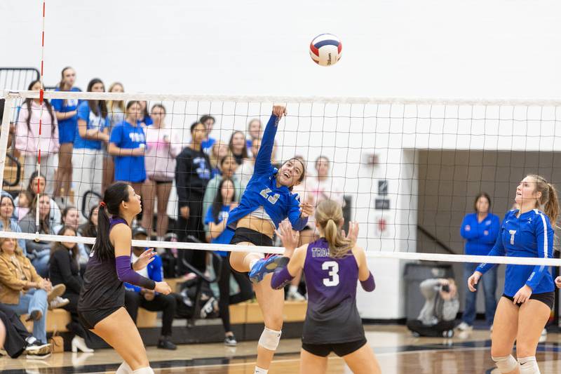 St. Charles North's Haley Burgdorf with the kill shot against Downers Grove North on Thursday Oct. 23, 2025 in St. Charles.