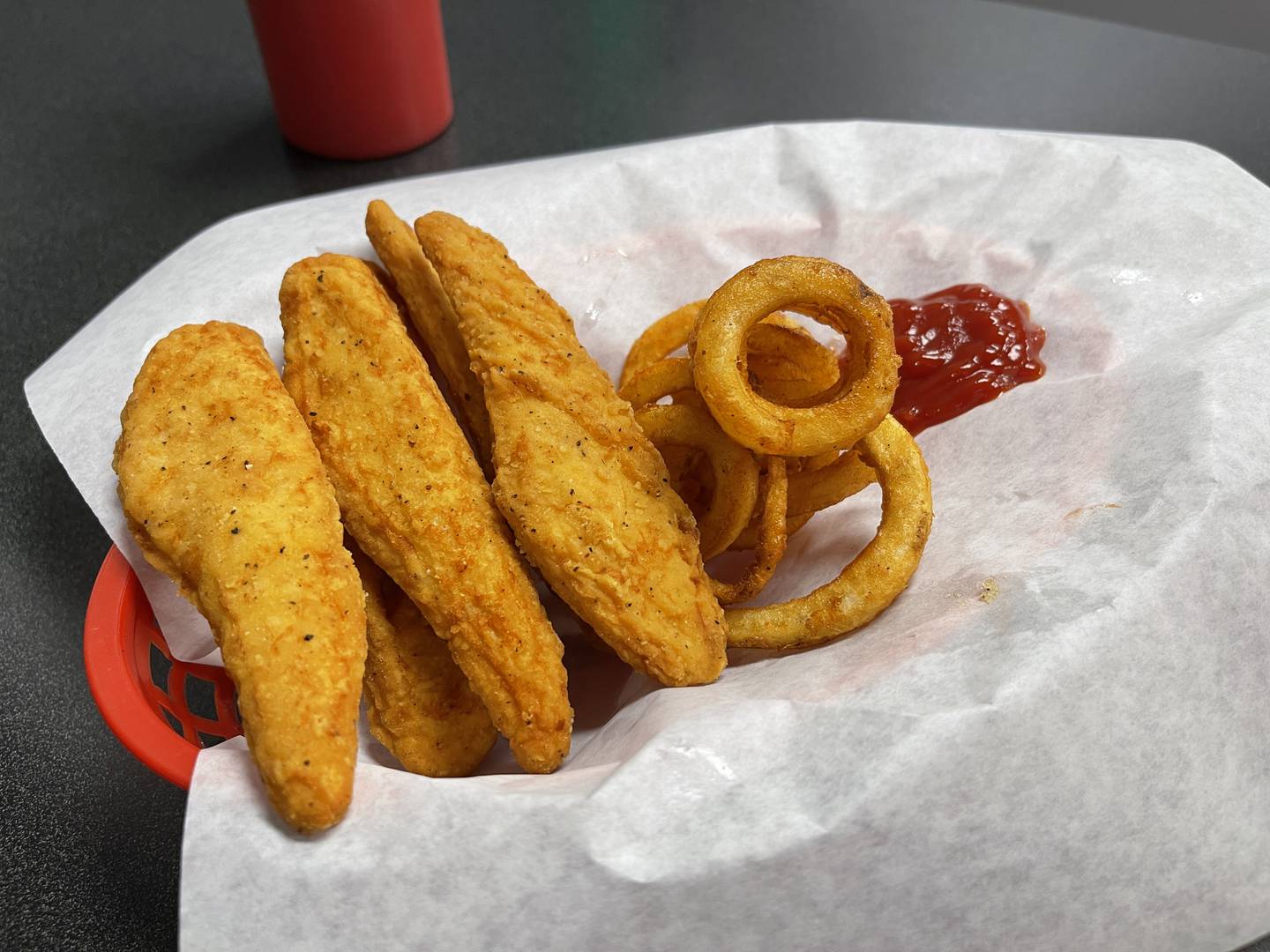 The chicken tenders paired with a side of fries and ketchup offers a nice, simple meal to those of all ages.