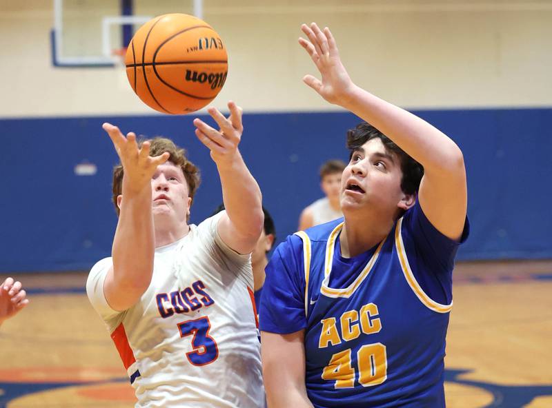 Genoa-Kingston's Jack Peterson and Aurora Central Catholic's Braden Dillon go after a rebound Monday, Feb. 23, 2026, during their IHSA Class 2A regional quarterfinal at Genoa-Kingston High School.