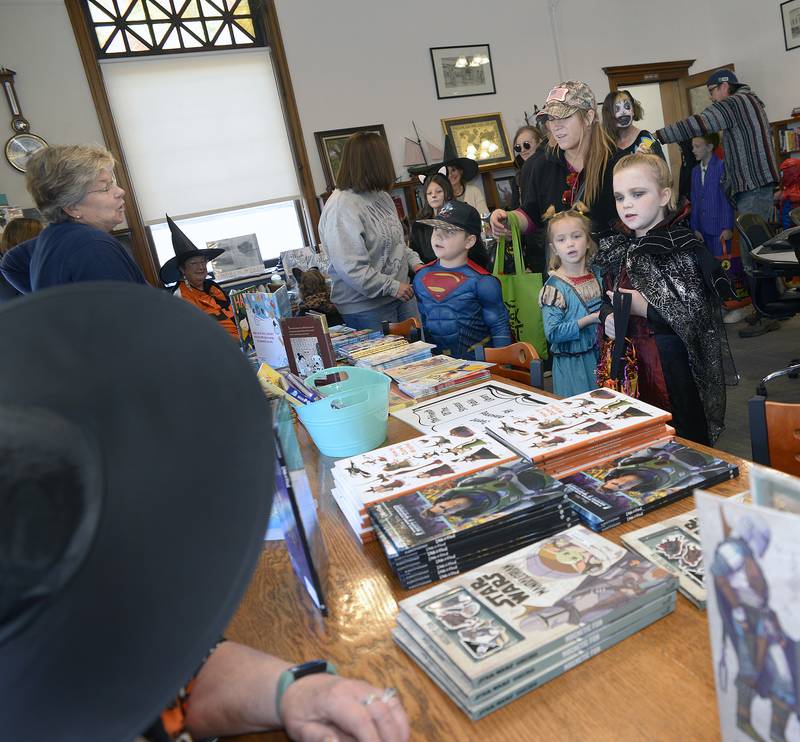 Treats for mind as children stopped by the Streator Public Library on Saturday, Oct. 26, 2024, during the annual downtown trick or treat and received a book of their choice.