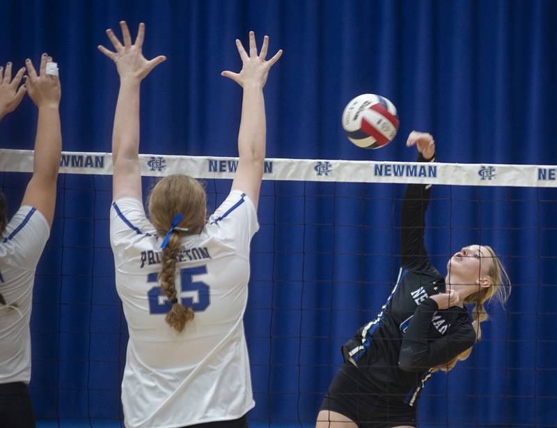 Newman’s Jess Johns spikes the ball Thursday, Sept. 15, 2022 against Princeton.