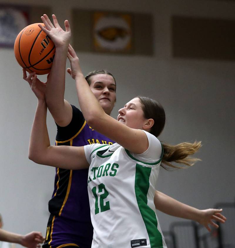 Crystal Lake South's Gaby Dzik tries to take a shot as she defended by Wauconda's Kelsey Piehl during the Northern Illinois Holiday Classic Championship girl basketball game on Thursday, Dec. 18, 2025, at McHenry High School.