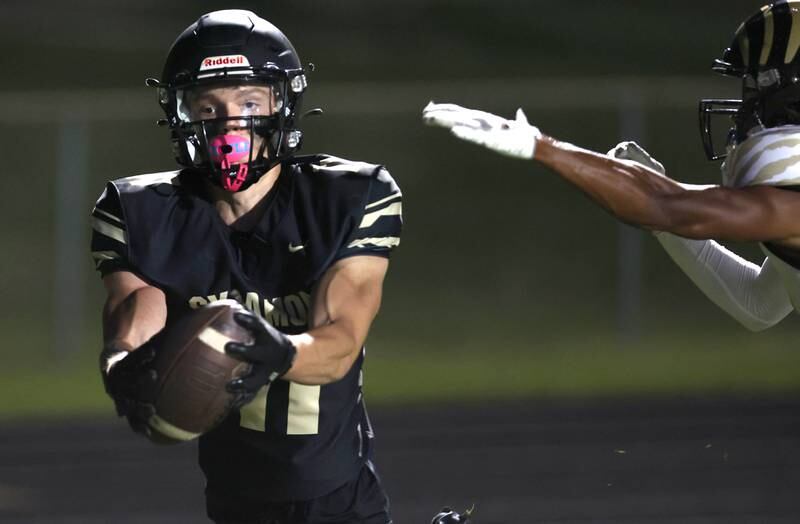 Sycamore's Burke Gautcher hauls in a touchdown catch during their game against Oak Forest Friday Sept. 2, 2022, at Sycamore High School.