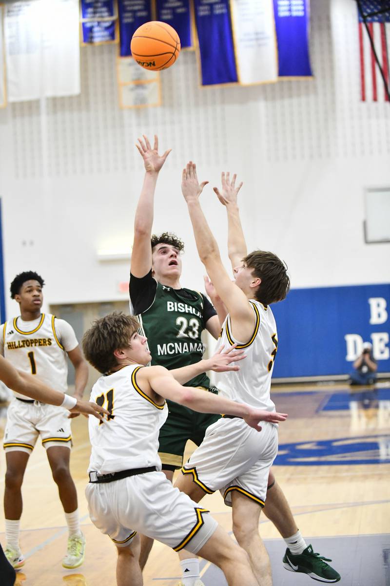 Bishop McNamara's Karter Krutsinger puts up a shot during the Fightin' Irish's 79-67 victory over Joliet Catholic Academy in the IHSA Class 2A Peotone Sectional semifinal on March 4, 2025.