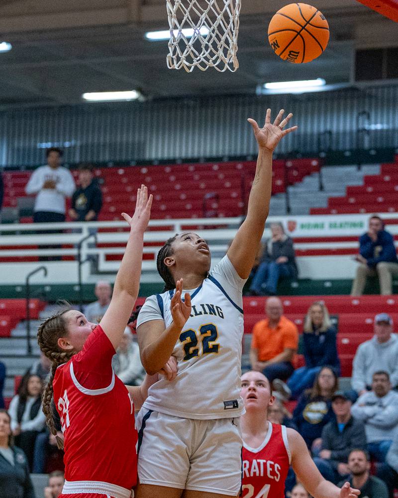 Joslyn Green (22) of Sterling lays up ball as Ottawa's Hailey Thrush (21) defends during Regional Championship game on Thursday, Feb. 19, 2026 in Sellett Gymnasium at L-P High School.