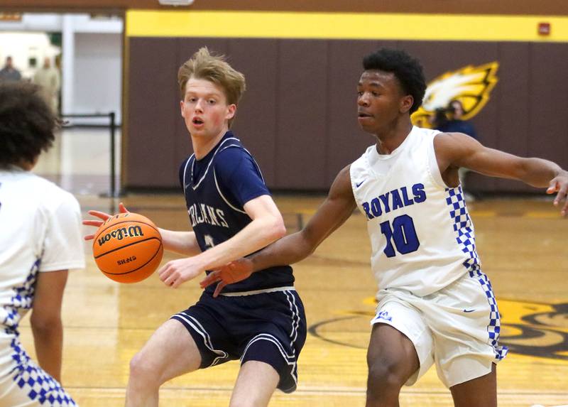 Cary-Grove’s AJ Berndt, left, scoots around Larkin’s Jahvion Sanders in varsity boys basketball Hinkle Holiday Classic action on Friday, Dec. 26, 2025, at Jacobs High School in Algonquin.