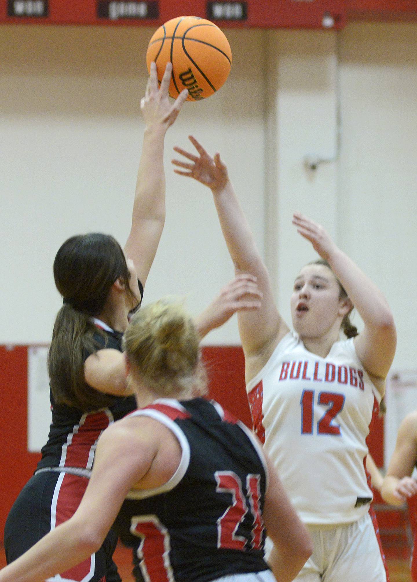 Streator’s Leah Krohe shoots just over the fingertips of Henry-Senachwine's Kaitlyn Anderson in the second quarter Tuesday at Streator.