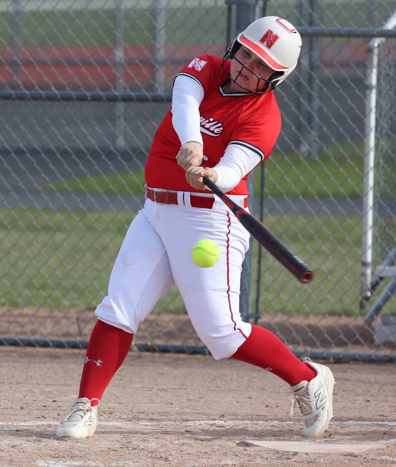 Naperville Central's Jamie Saran makes contact Wednesday, April 16, 2025, during their game at DeKalb High School.